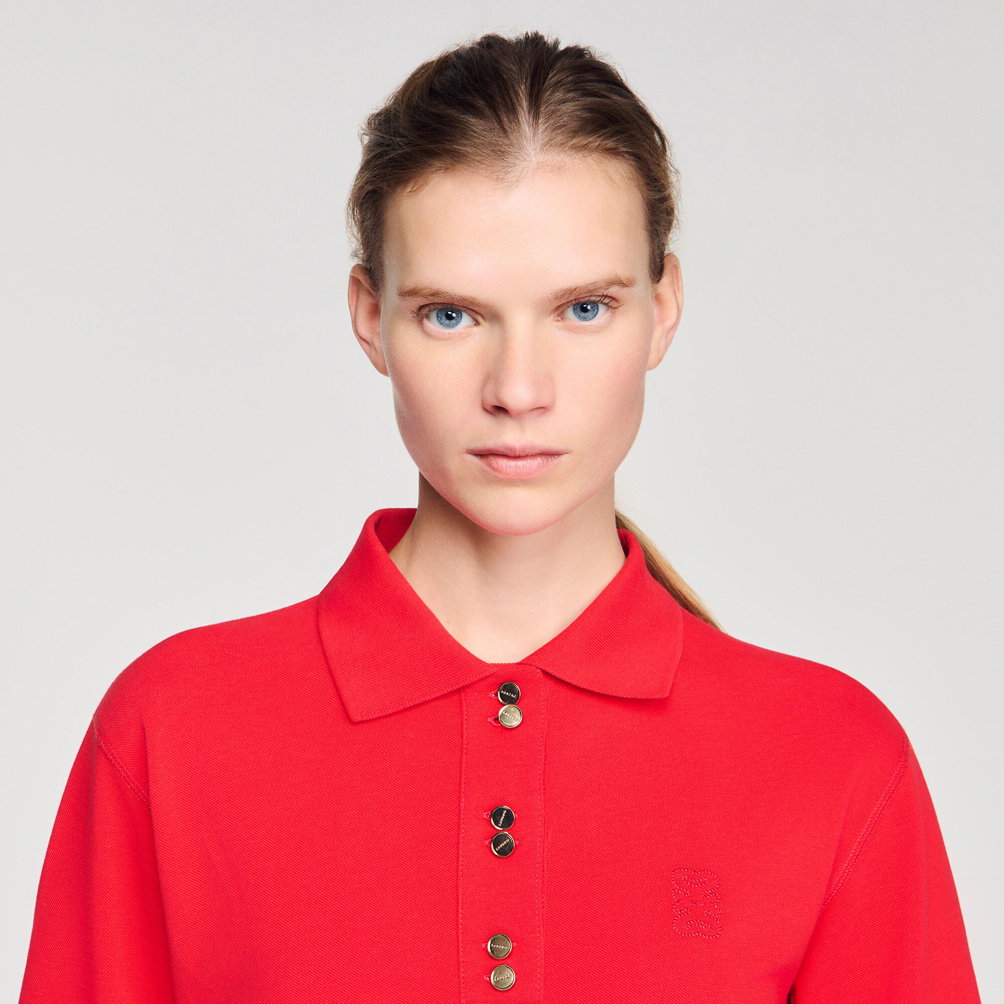 Polo shirt with decorative buttons