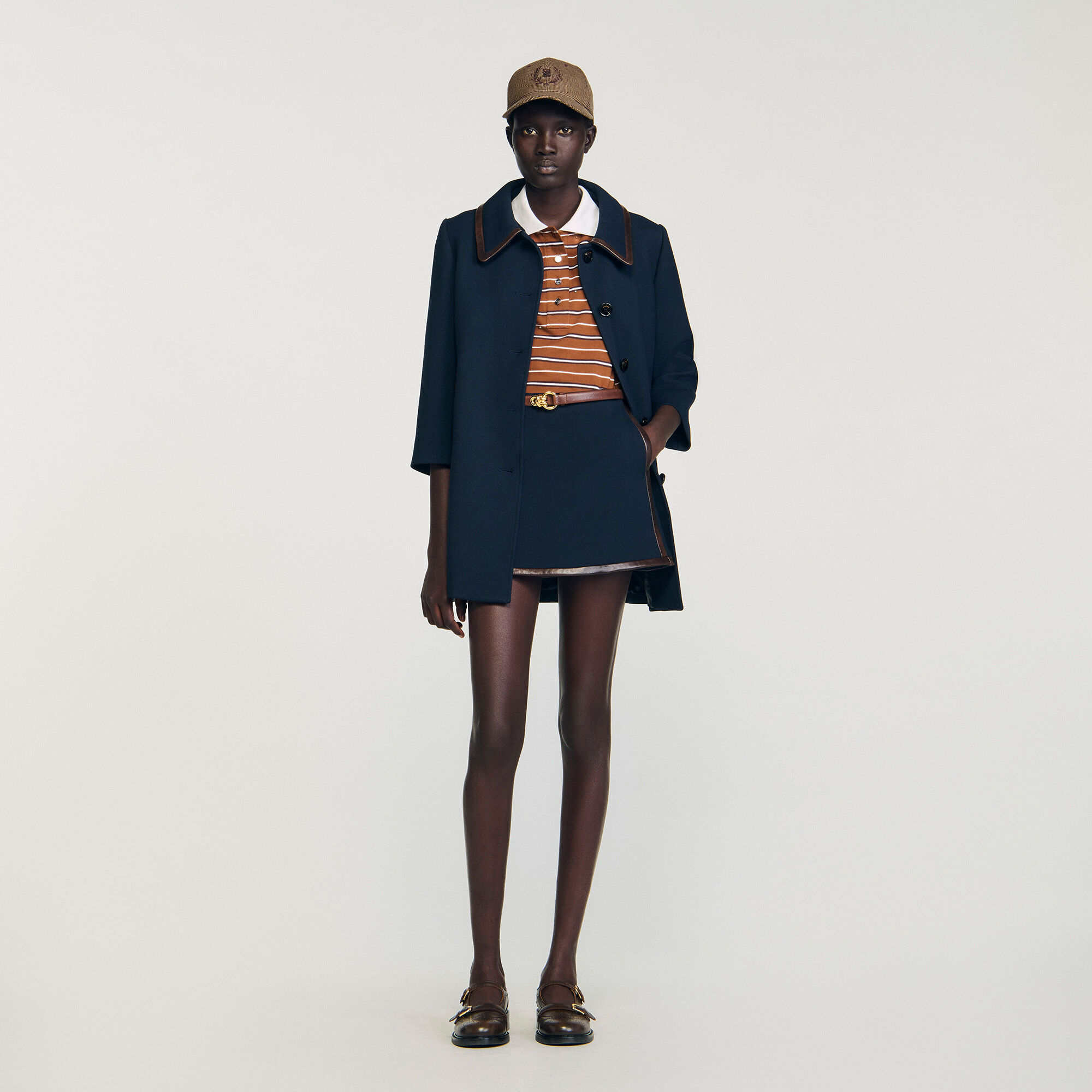 Short skirt with leather bands