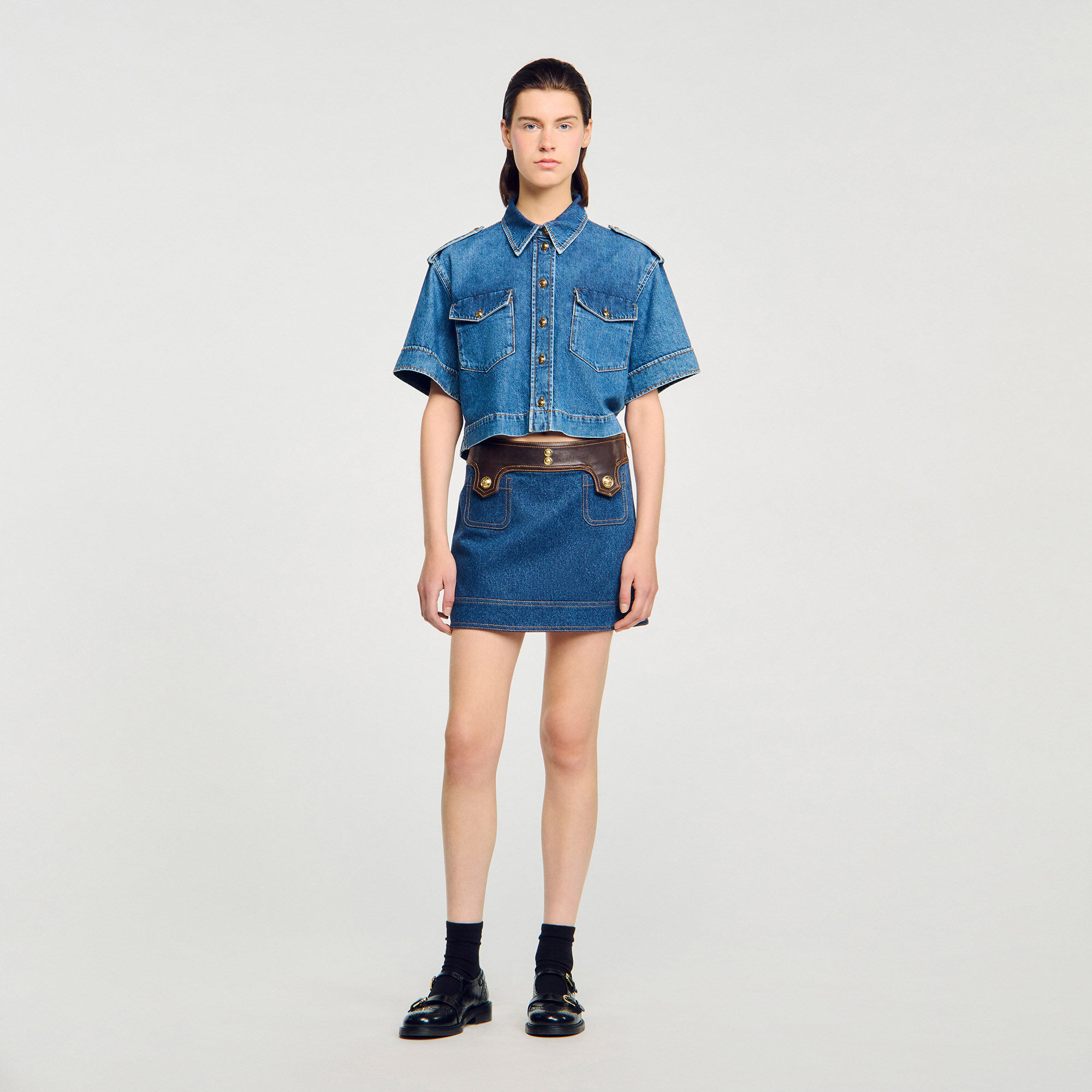 Short denim and leather skirt