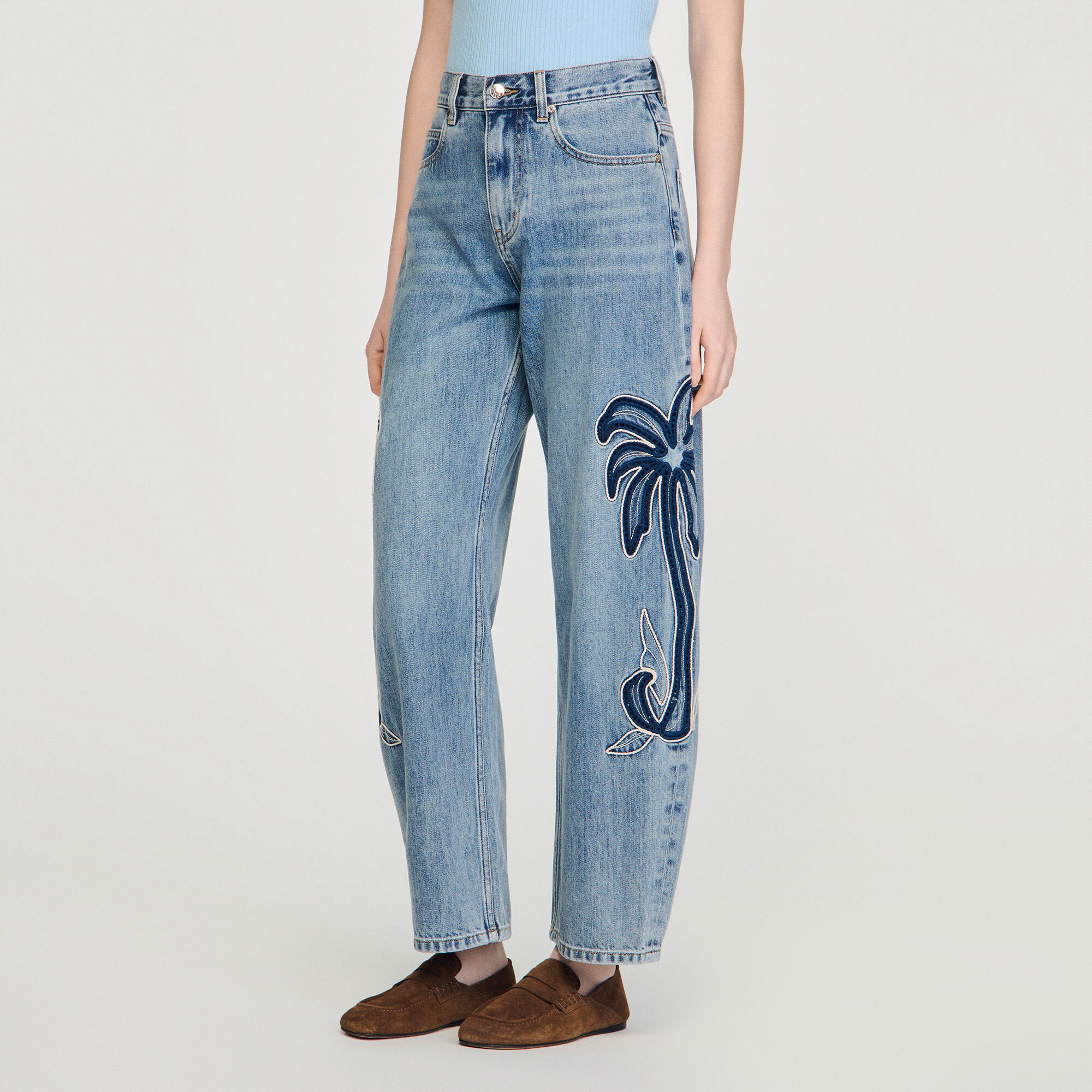 Palm-embroidered wide barrel jeans