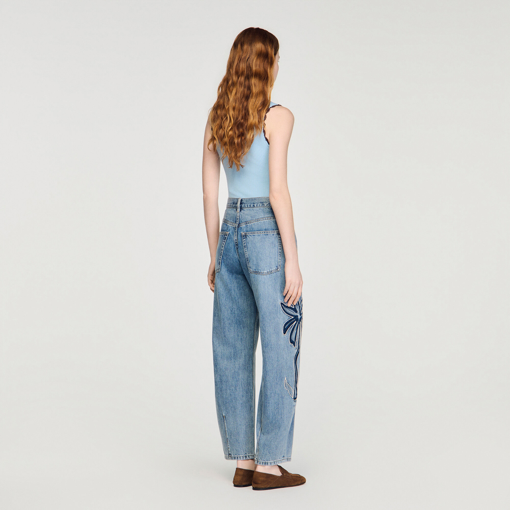 Palm-embroidered wide barrel jeans