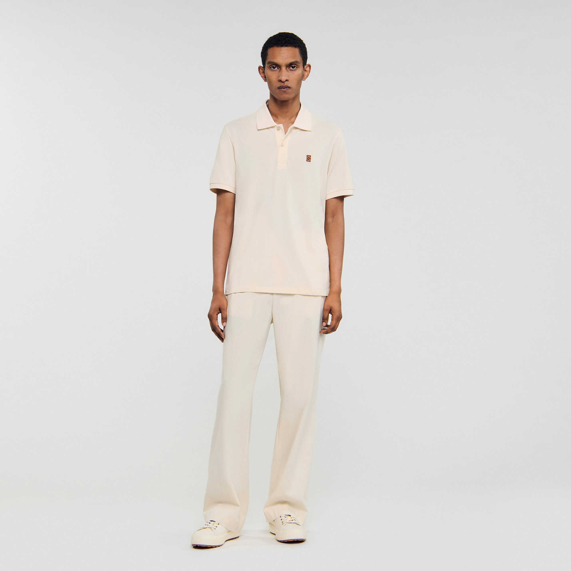 Polo shirt with leather logo