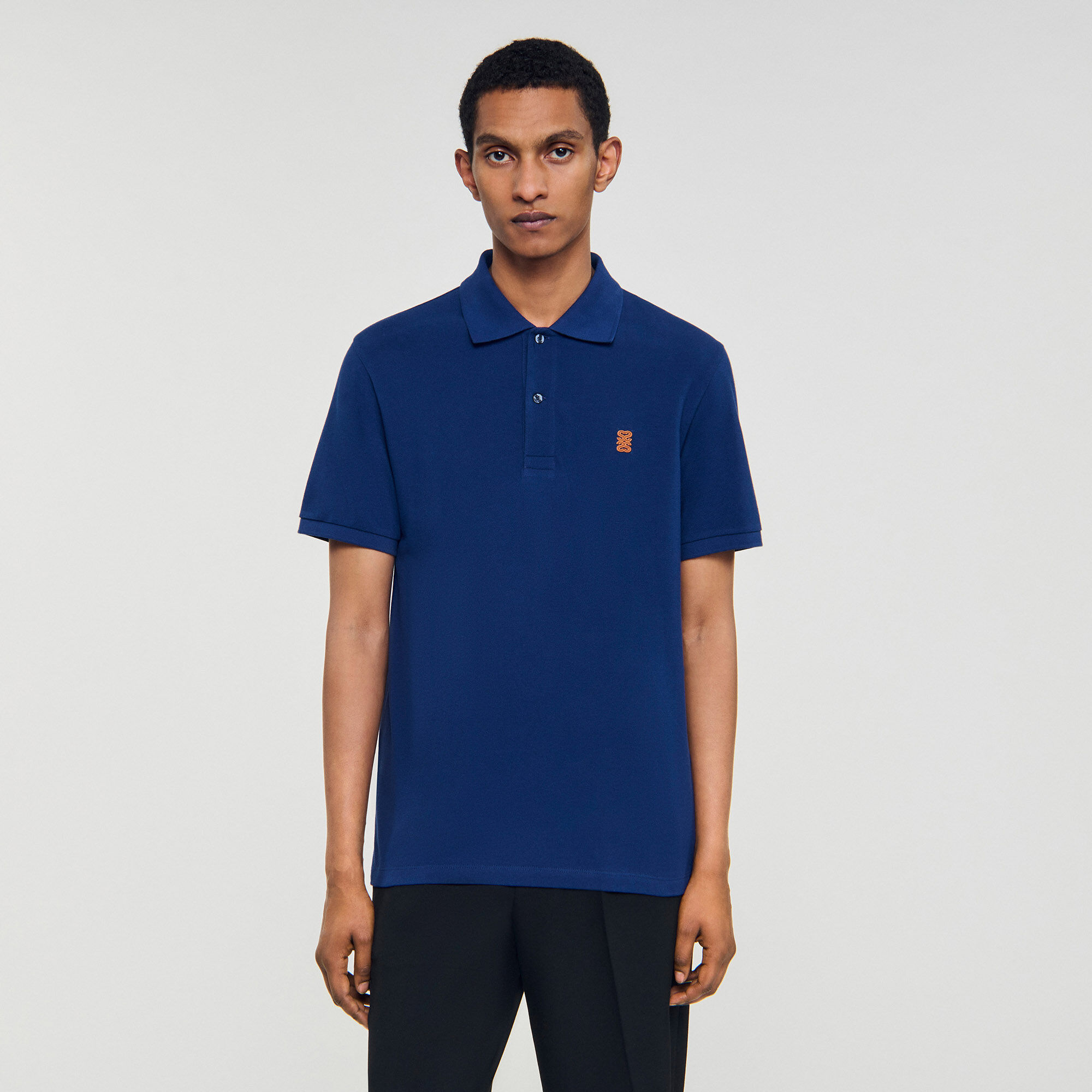 Polo shirt with leather logo Polo shirt with leather logo