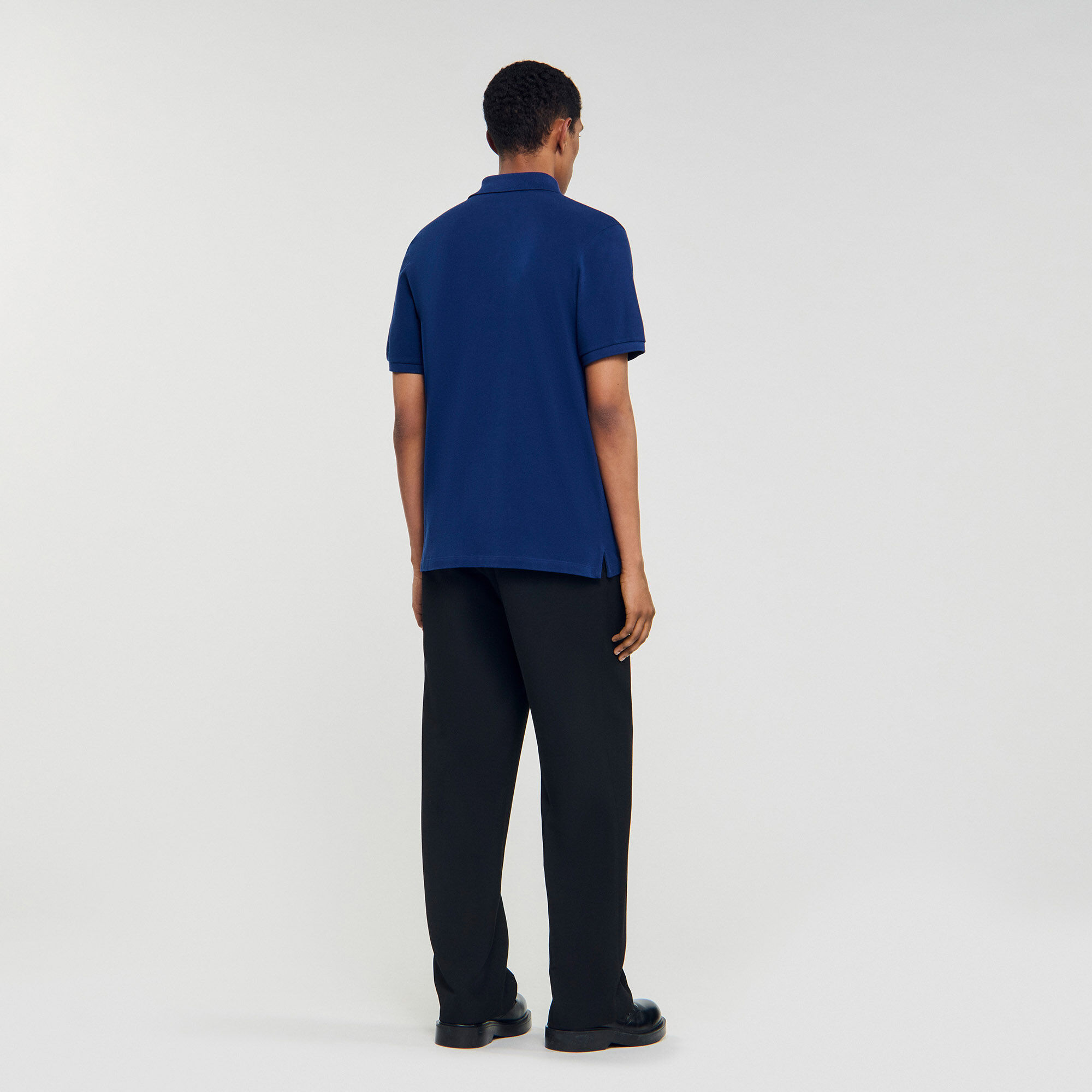 Polo shirt with leather logo Polo shirt with leather logo