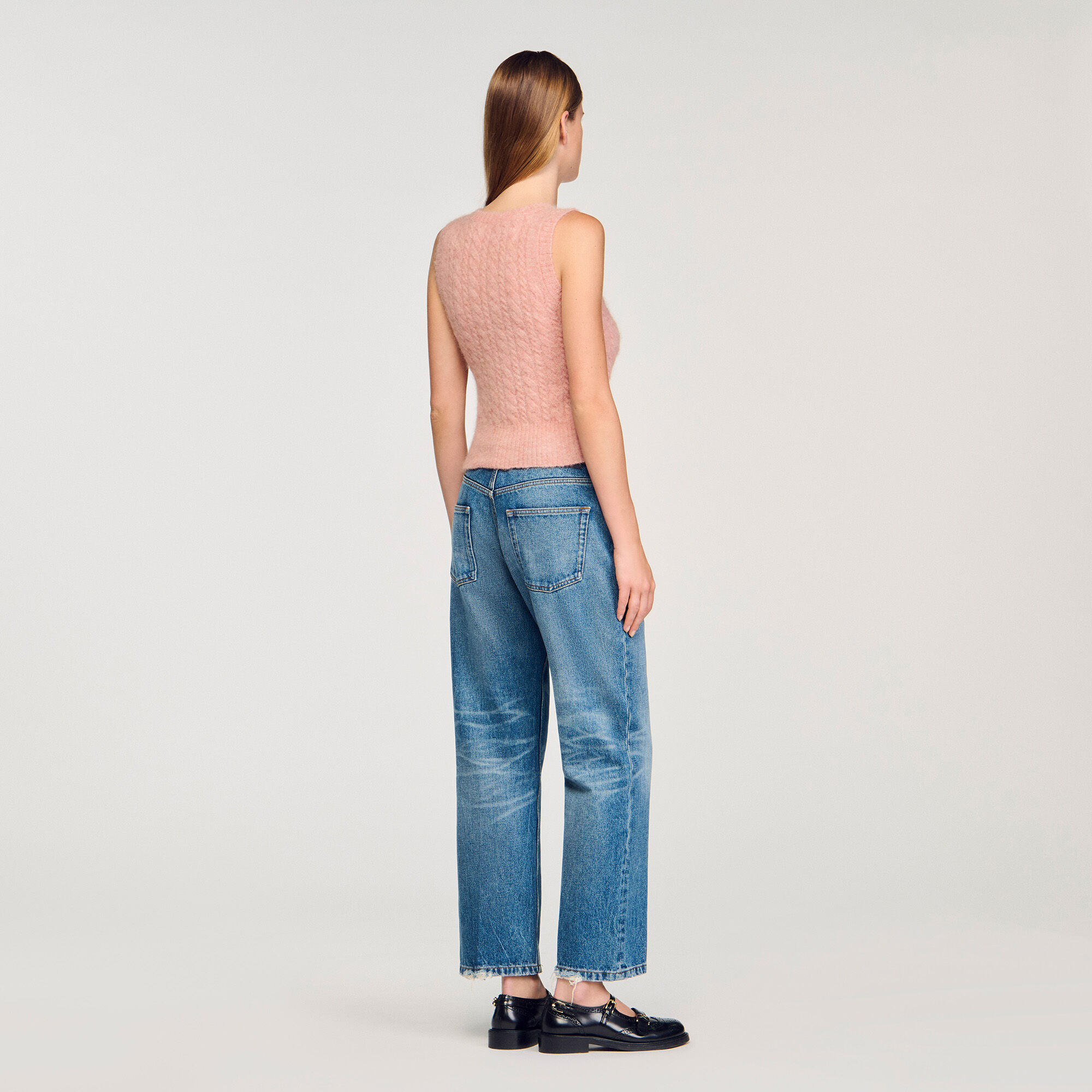 Sleeveless cable knit sweater