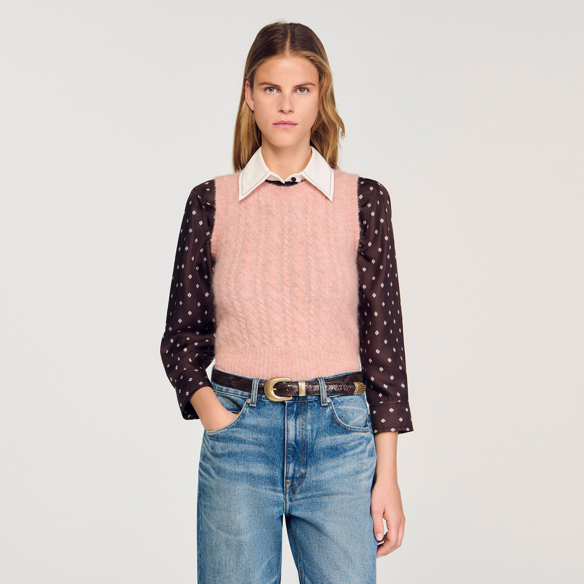 Sleeveless cable knit sweater