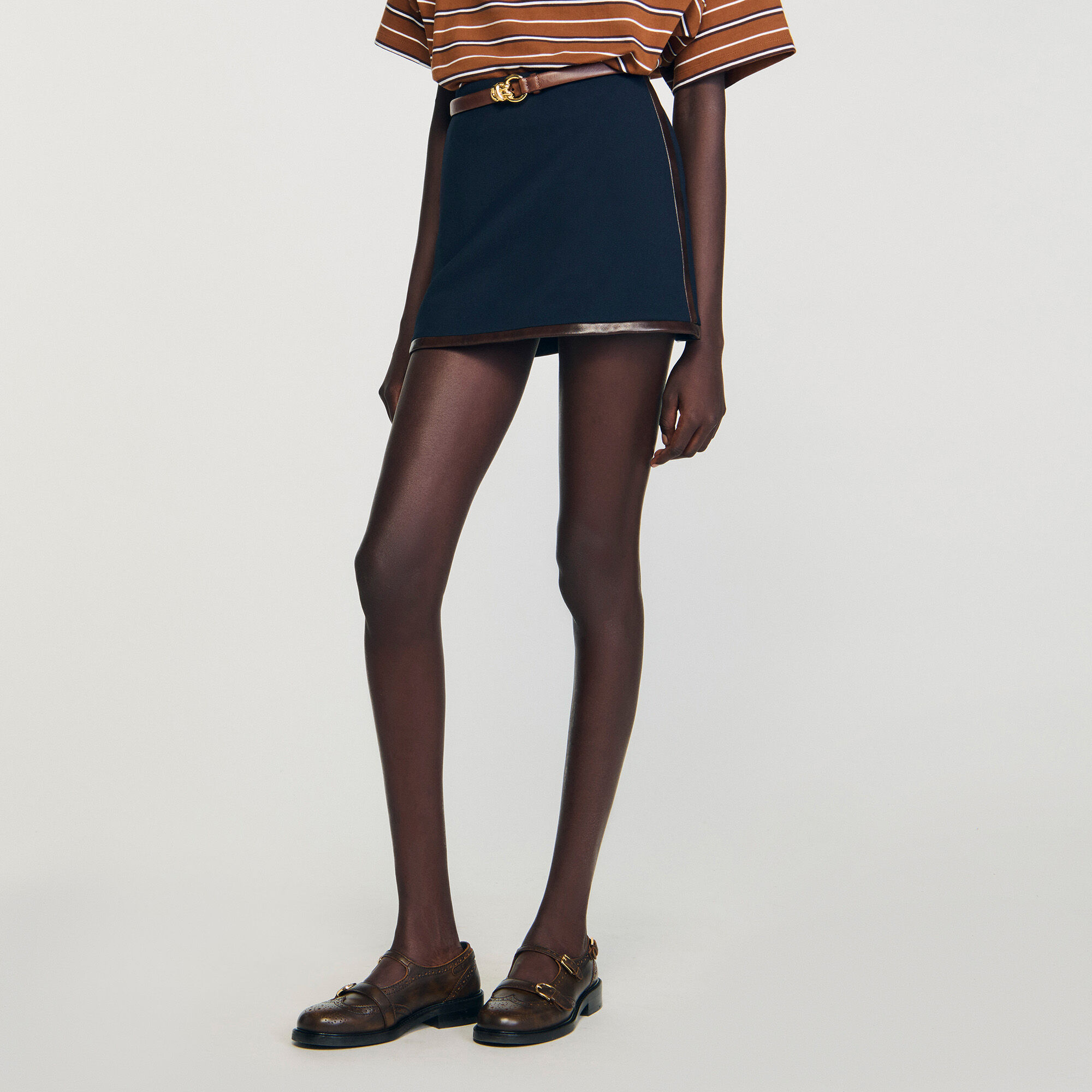 Short skirt with leather bands