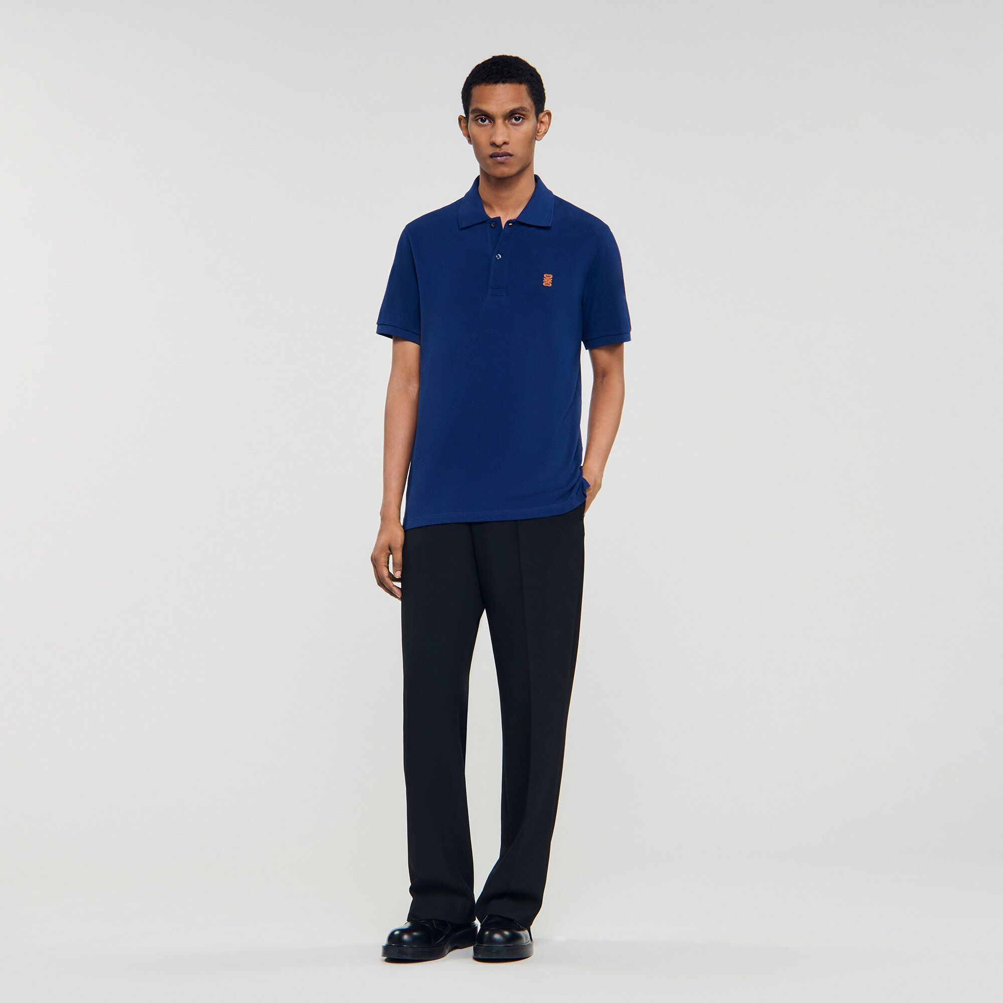 Polo shirt with leather logo Polo shirt with leather logo