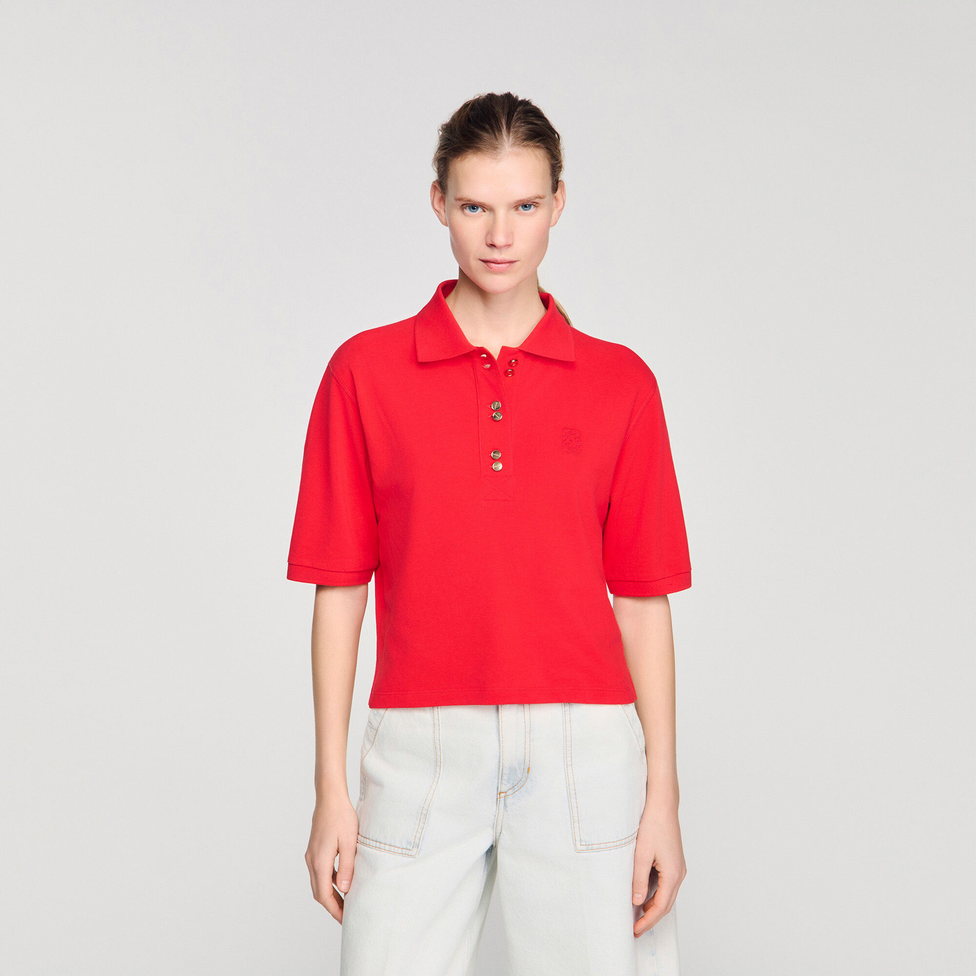 Polo shirt with decorative buttons