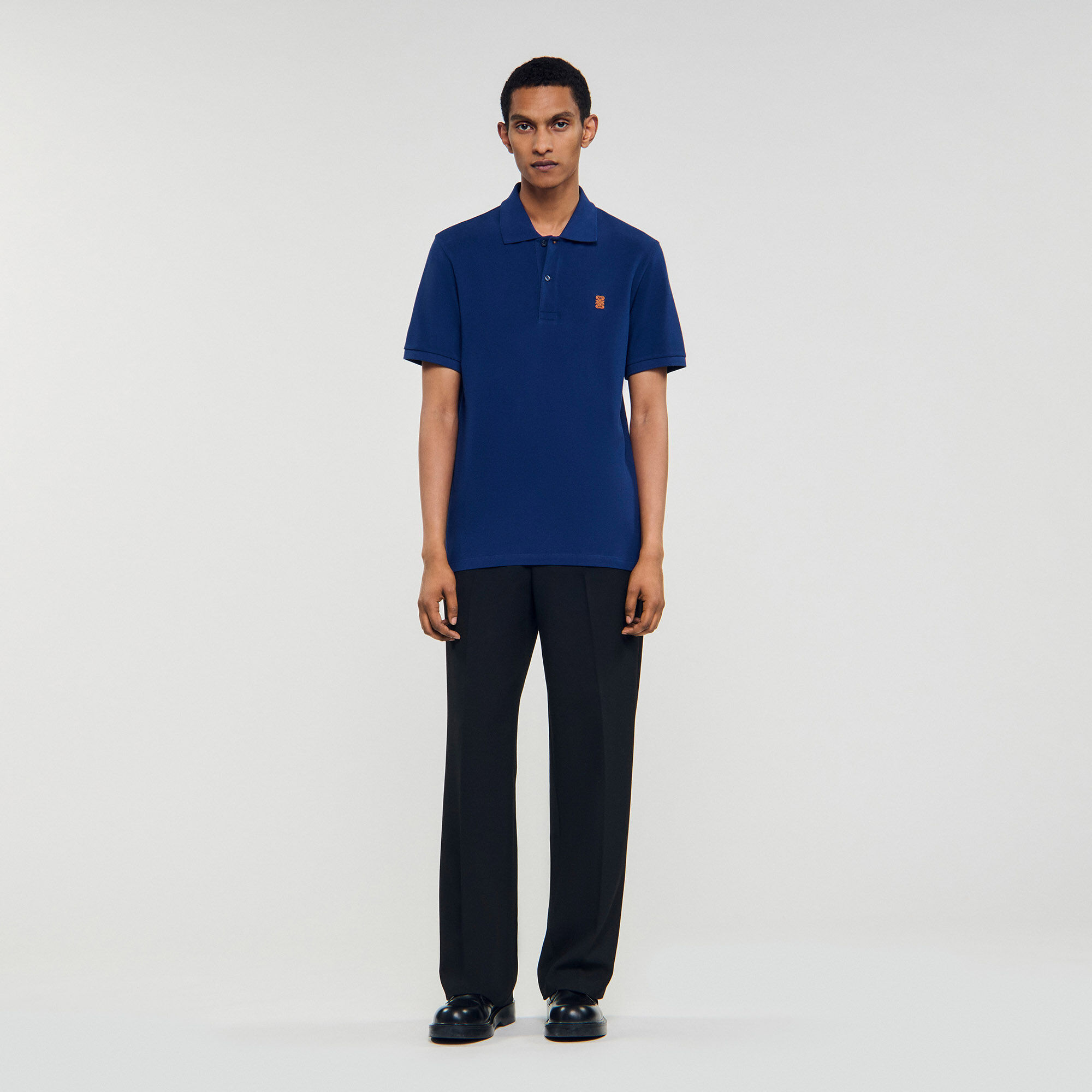 Polo shirt with leather logo Polo shirt with leather logo